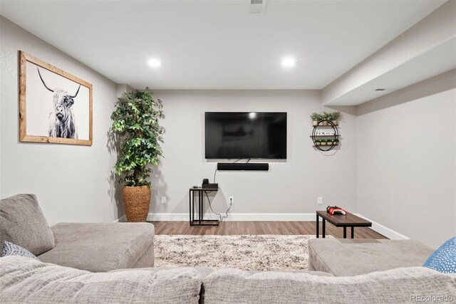 12942 Leyden St, Thornton, CO 80602 - living room with wood finished floors, recessed lighting, and baseboards