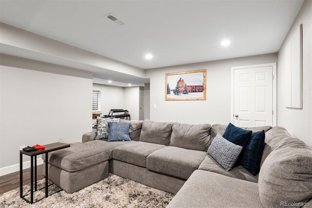 12942 Leyden St, Thornton, CO 80602 - living room featuring recessed lighting, dark wood-style floors, and baseboards