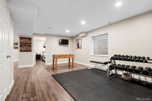 12942 Leyden St, Thornton, CO 80602 - workout area featuring wood finished floors, baseboards, and recessed lighting