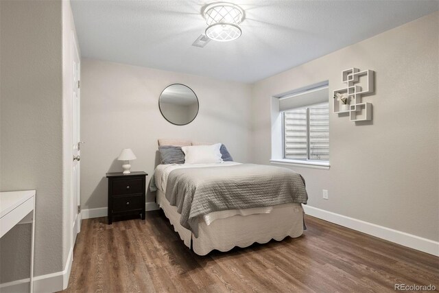 12942 Leyden St, Thornton, CO 80602 - bedroom with wood finished floors and baseboards