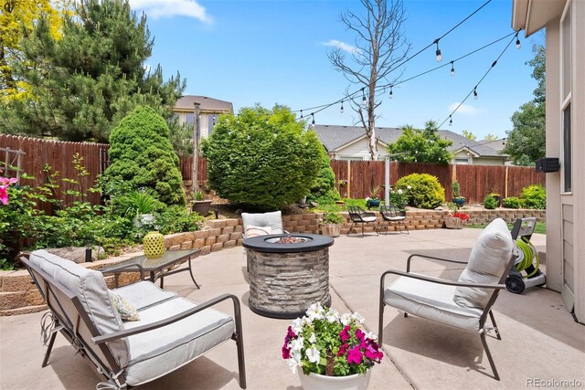 12942 Leyden St, Thornton, CO 80602 - fenced backyard featuring an outdoor fire pit and a patio area
