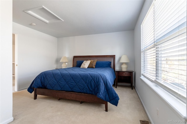 bedroom featuring light carpet