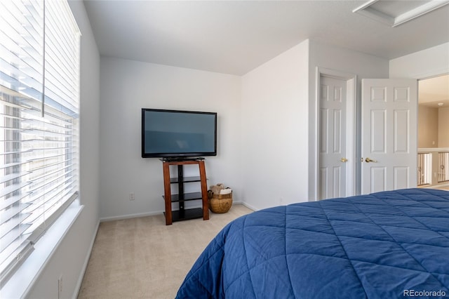 bedroom featuring light carpet