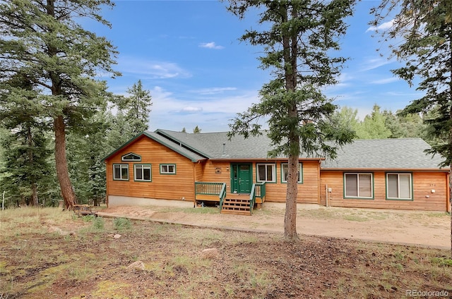 view of front of home featuring a wooden deck