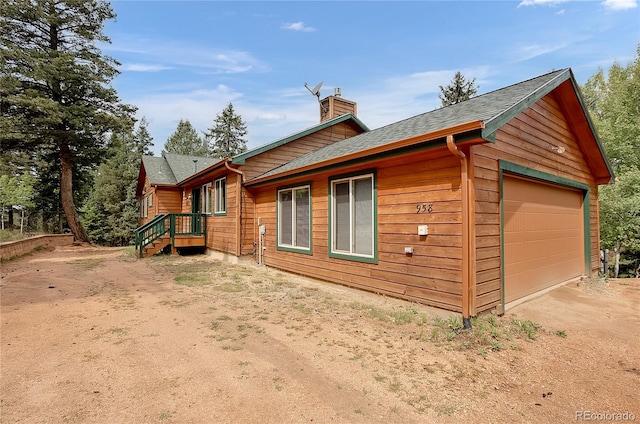 view of side of property featuring a garage