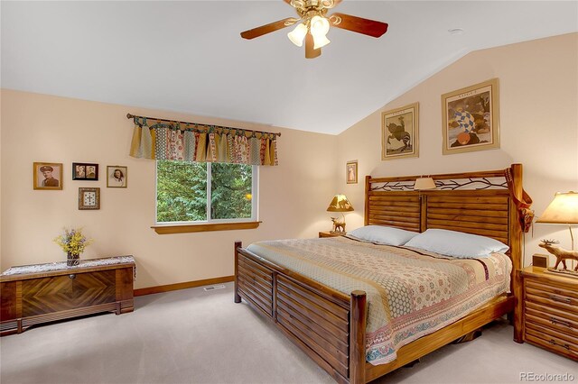 bedroom with carpet flooring, ceiling fan, and vaulted ceiling