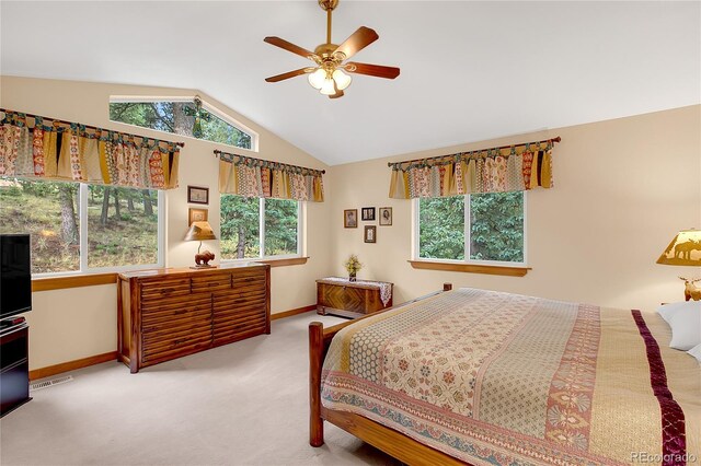 bedroom with lofted ceiling, ceiling fan, and light carpet