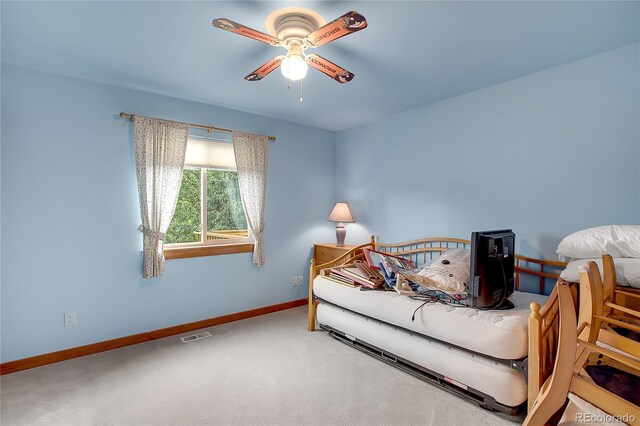 carpeted bedroom with ceiling fan