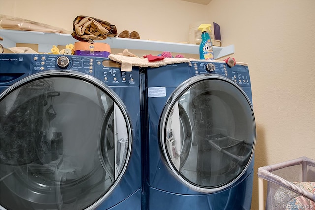 washroom with washer and clothes dryer