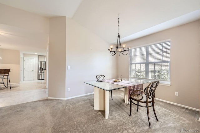 7774 S Biloxi Way, Aurora, CO 80016 - dining area featuring a chandelier, light colored carpet, and lofted ceiling