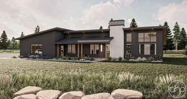 65960 E Evans Pl, Byers, CO 80103 - view of front of home with a front lawn and covered porch