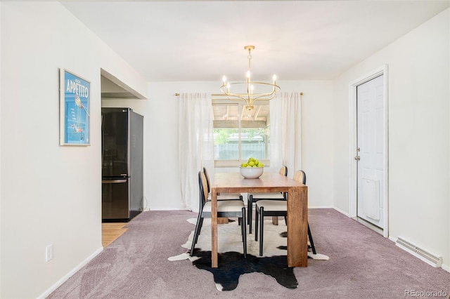 85 S Flower St, Lakewood, CO 80226 - carpeted dining space featuring a chandelier and baseboards