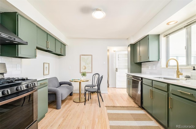 85 S Flower St, Lakewood, CO 80226 - kitchen with green cabinetry, appliances with stainless steel finishes, and a sink