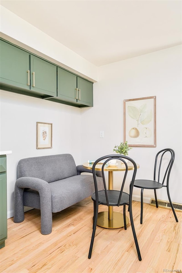 85 S Flower St, Lakewood, CO 80226 - dining space with light wood finished floors and baseboards