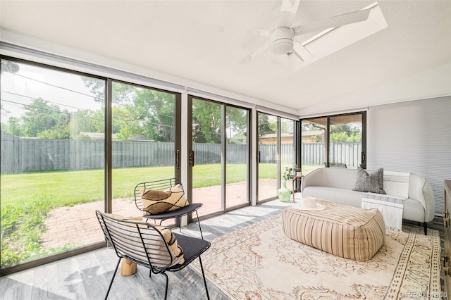 85 S Flower St, Lakewood, CO 80226 - sunroom / solarium featuring ceiling fan, lofted ceiling, healthy amount of natural light, and an outdoor living space
