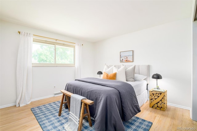 85 S Flower St, Lakewood, CO 80226 - bedroom with light wood-style floors and baseboards