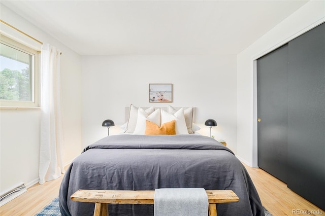 85 S Flower St, Lakewood, CO 80226 - bedroom with light wood-type flooring, a closet, and baseboards