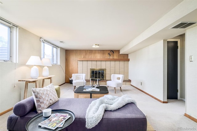 85 S Flower St, Lakewood, CO 80226 - carpeted living area with a brick fireplace, baseboards, and wooden walls