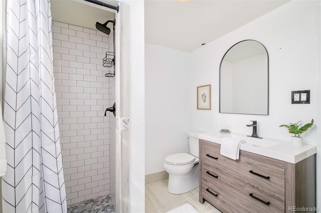 85 S Flower St, Lakewood, CO 80226 - bathroom with vanity, a stall shower, and toilet