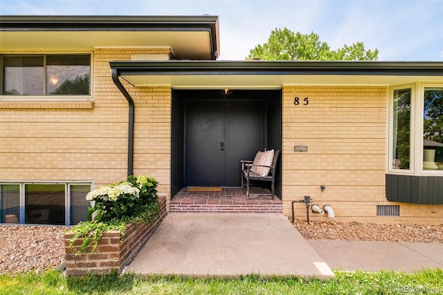 85 S Flower St, Lakewood, CO 80226 - property entrance with brick siding and crawl space