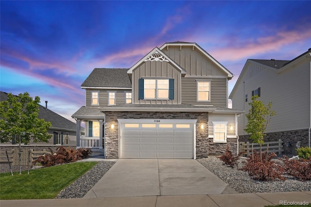7166 S Vandriver Way, Aurora, CO 80016 - craftsman inspired home with board and batten siding, driveway, stone siding, and an attached garage