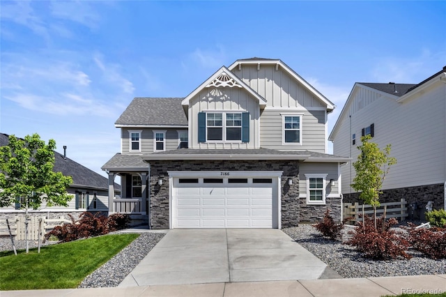 7166 S Vandriver Way, Aurora, CO 80016 - craftsman inspired home with board and batten siding, concrete driveway, an attached garage, stone siding, and roof with shingles