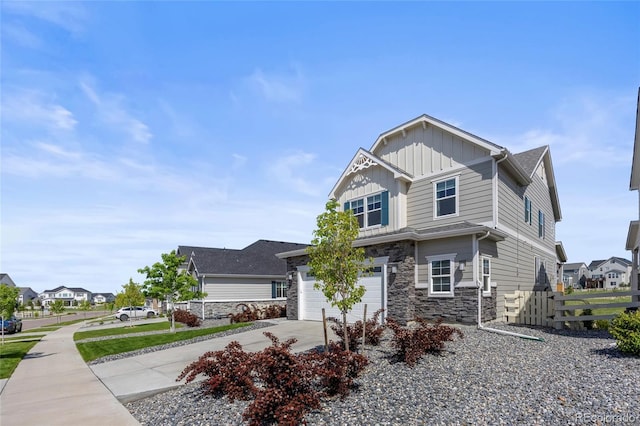 7166 S Vandriver Way, Aurora, CO 80016 - view of front of house featuring stone siding, board and batten siding, driveway, and a residential view