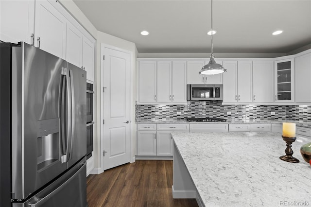7166 S Vandriver Way, Aurora, CO 80016 - kitchen featuring appliances with stainless steel finishes, white cabinets, glass insert cabinets, and recessed lighting