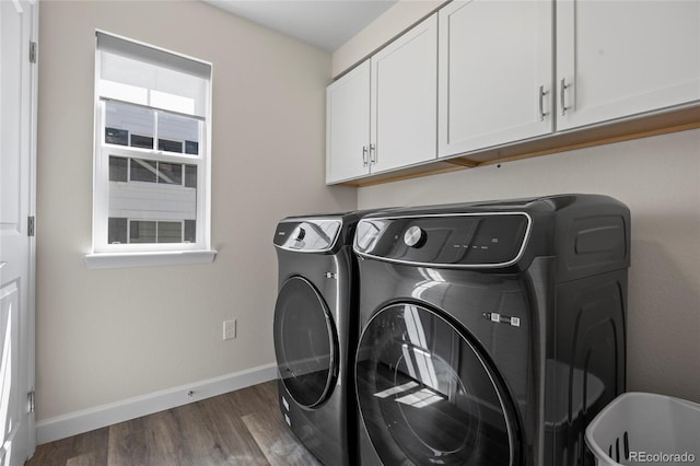 7166 S Vandriver Way, Aurora, CO 80016 - laundry room with cabinet space, washing machine and clothes dryer, and wood finished floors