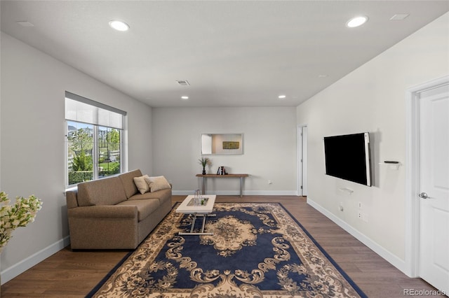7166 S Vandriver Way, Aurora, CO 80016 - living area featuring wood finished floors and recessed lighting