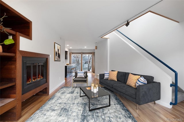 1805 Cheyenne Blvd, Colorado Springs, CO 80906 - living area featuring recessed lighting, baseboards, a glass covered fireplace, and wood finished floors