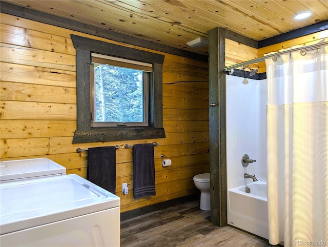 1857 Sturm Ln, Fort Garland, CO 81133 - bathroom with washing machine and dryer, wooden ceiling, wooden walls, shower / tub combo with curtain, and wood finished floors
