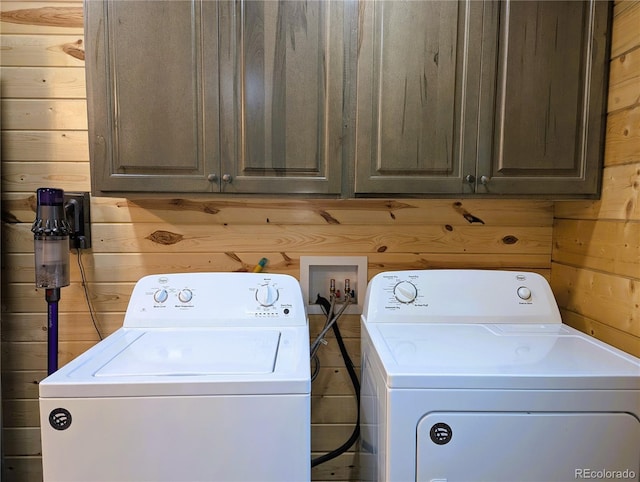 1857 Sturm Ln, Fort Garland, CO 81133 - washroom with washer and dryer, wooden walls, and cabinet space