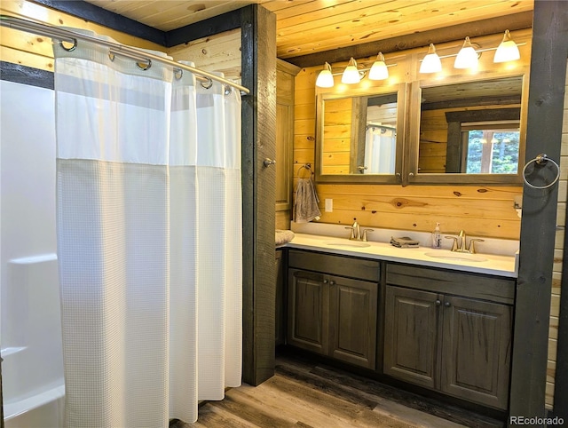 1857 Sturm Ln, Fort Garland, CO 81133 - full bathroom featuring wood finished floors, double vanity, wooden ceiling, and wood walls