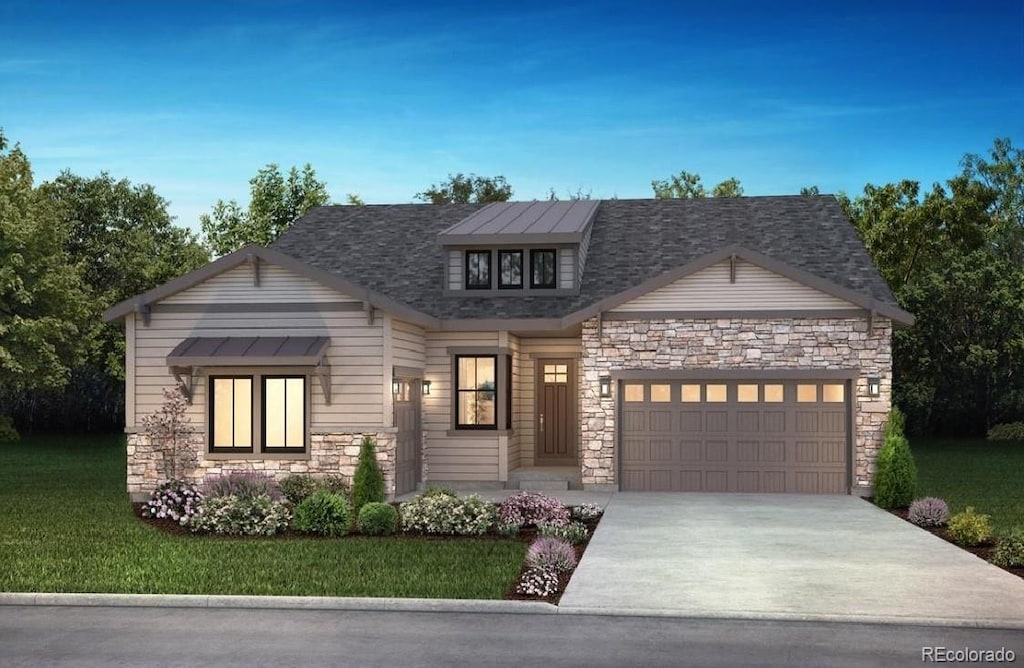 view of front of home featuring a garage and a front lawn