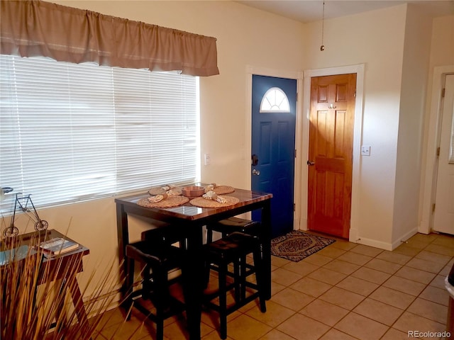 dining area featuring tile patterned flooring