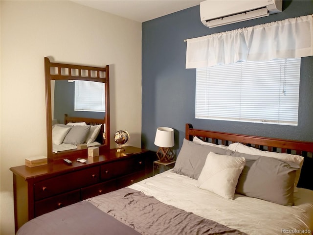 bedroom with a wall mounted AC