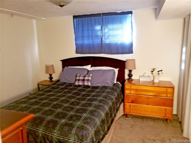 bedroom featuring carpet