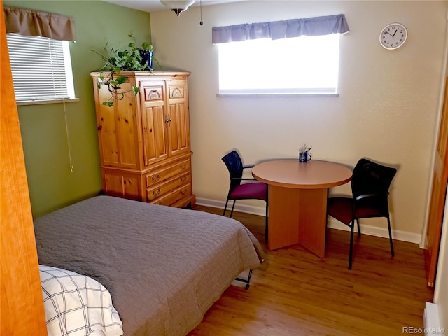 bedroom with hardwood / wood-style floors