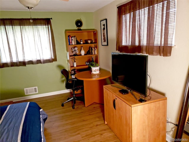 home office with light wood-type flooring