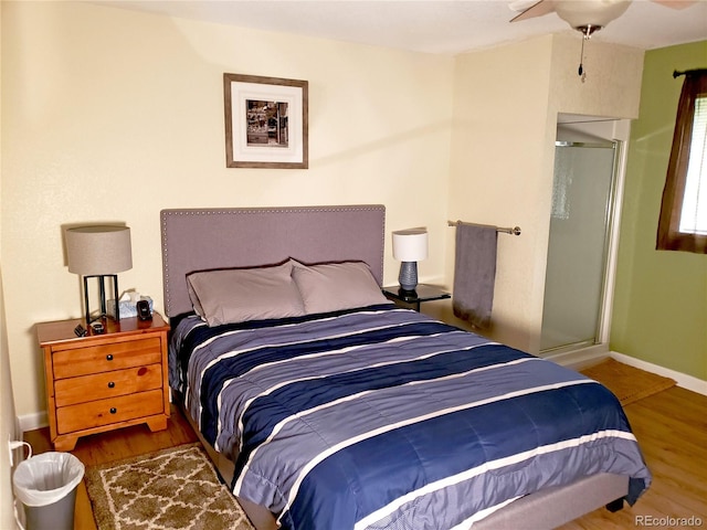 bedroom featuring wood-type flooring and ceiling fan