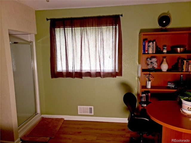 office space with hardwood / wood-style floors