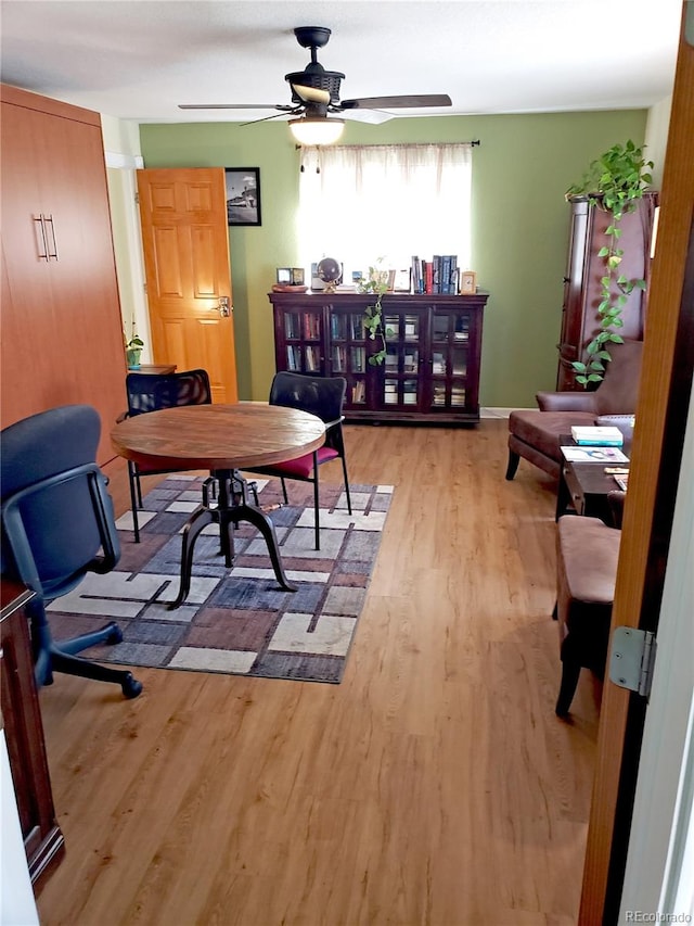 office area with ceiling fan and light hardwood / wood-style floors