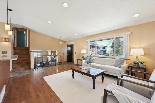 living room featuring recessed lighting, wood finished floors, stairs, and vaulted ceiling