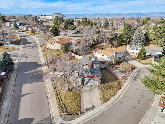 drone / aerial view featuring a mountain view and a residential view