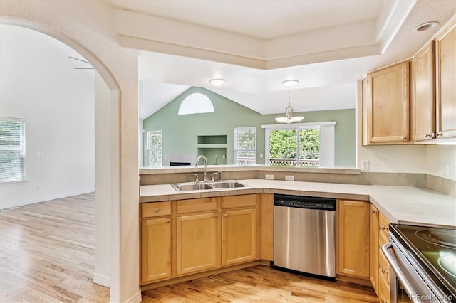 2330 S Salem Cir, Aurora, CO 80014 - kitchen with stainless steel appliances, light wood-style flooring, vaulted ceiling, arched walkways, and light countertops