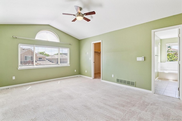 2330 S Salem Cir, Aurora, CO 80014 - unfurnished bedroom featuring lofted ceiling, a spacious closet, carpet floors, connected bathroom, and a ceiling fan