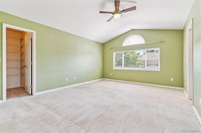2330 S Salem Cir, Aurora, CO 80014 - unfurnished room featuring lofted ceiling, carpet floors, and a ceiling fan