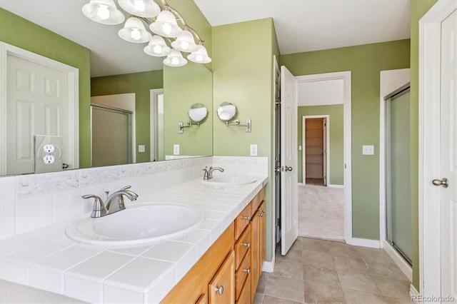 2330 S Salem Cir, Aurora, CO 80014 - full bath with double vanity, tile patterned flooring, a stall shower, and a chandelier