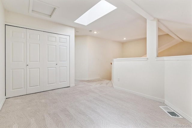 2330 S Salem Cir, Aurora, CO 80014 - additional living space with carpet floors, a skylight, and recessed lighting